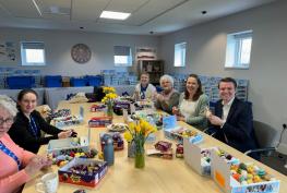 Volunteers stuff thousands of knitted creations as part of Big Chick Knit campaign