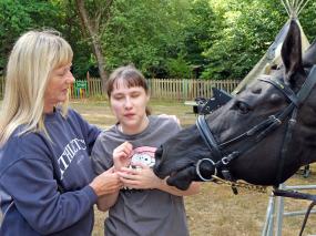 Horsing around: Racehorse visits children’s special needs day centre