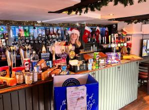 Burnham's The Bee pub donates to Slough Food Bank