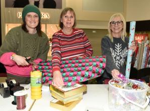 Volunteers wrap gifts in Maidenhead's Nicholsons Centre to raise funds for Thames Hospice