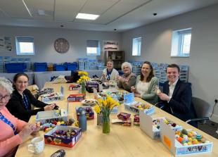 Volunteers stuff thousands of knitted creations as part of Big Chick Knit campaign
