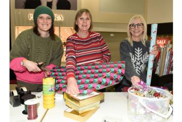 Volunteers wrap gifts in Maidenhead's Nicholsons Centre to raise funds for Thames Hospice