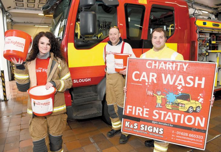 Firefighters brave the rain to raise £1939 at charity car wash Photo