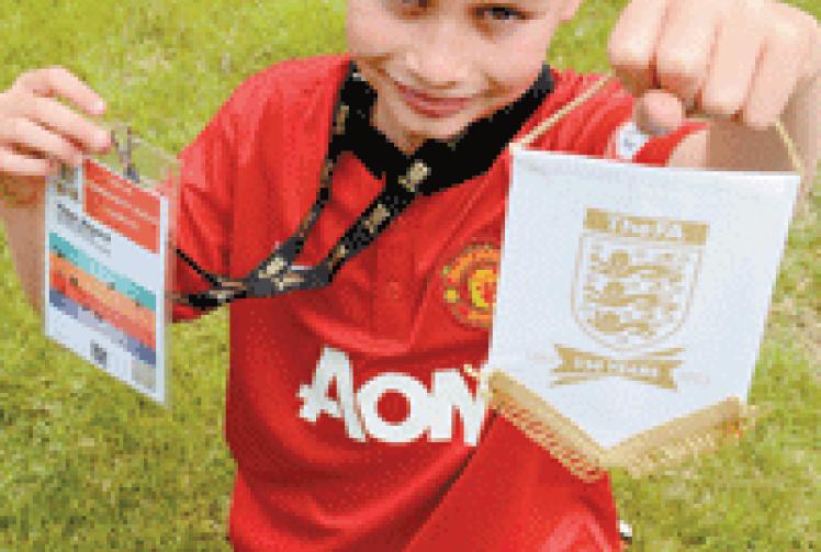 Young football fan becomes player escort for Manchester United