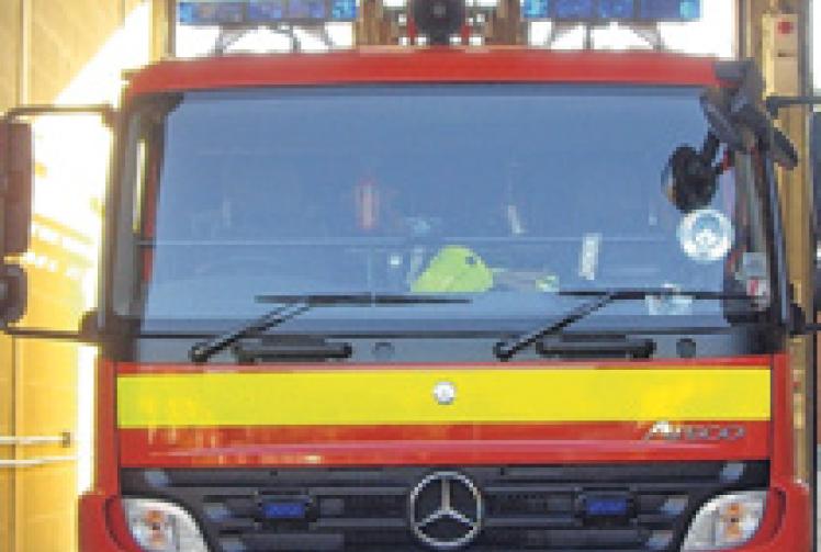 Van becomes trapped under railway bridge