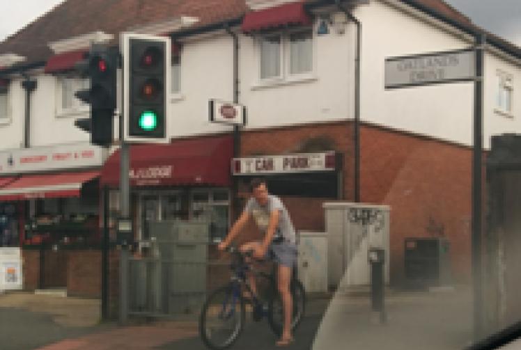 Image released in search for cyclist who followed and spat at driver