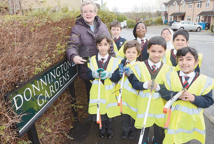 Staff and pupils at Riverside Primary School sign up to