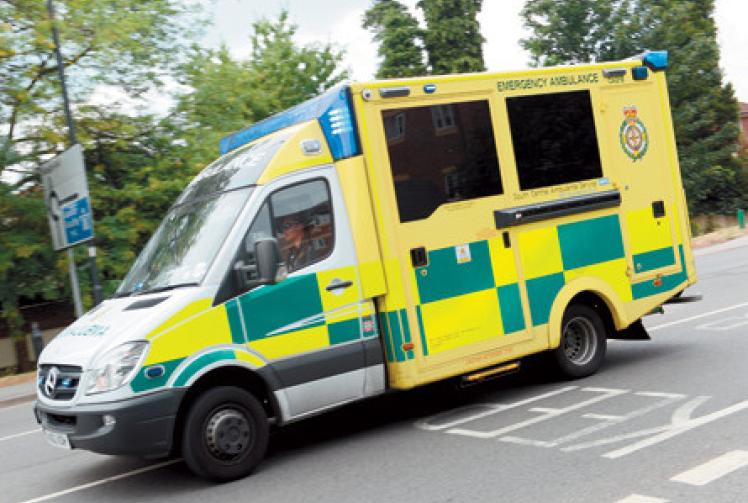 Woman taken to hospital after collision with ambulance