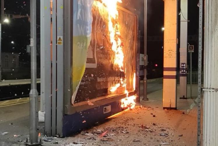 Advertising board catches fire at Slough fire station