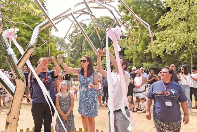 Sands charity hold memorial a year after unveiling tree at Ray Mill Island