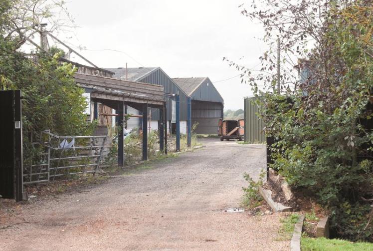 Residents object to farmland switching to business site Photo 1 of 1