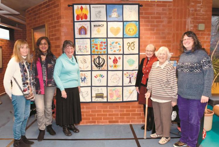 Interfaith group women make patchwork celebrating diversity