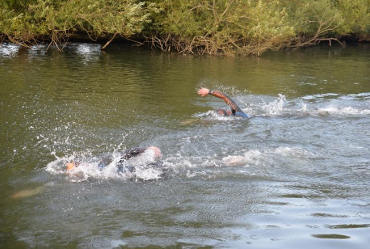 Team-mates take top three places at club to pub swim
